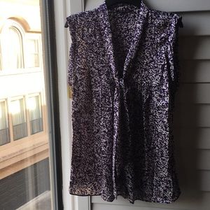 Purple and white print sleeveless blouse